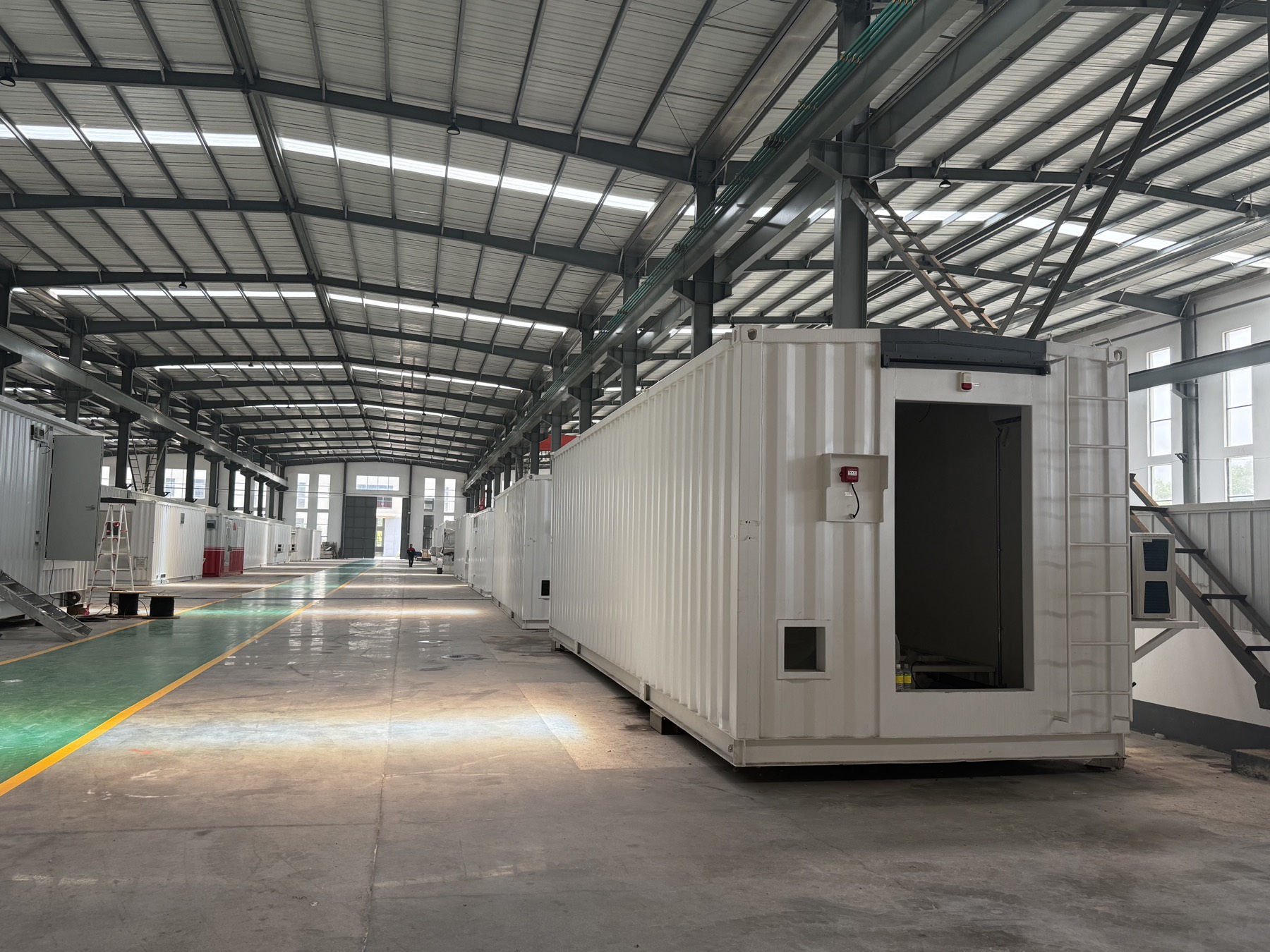 Factory line with modular E-House units under assembly